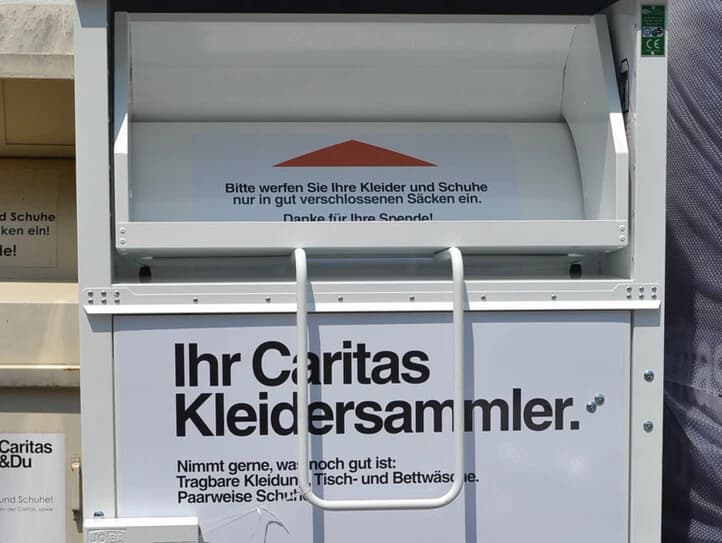 A Caritas clothing donation container on the street