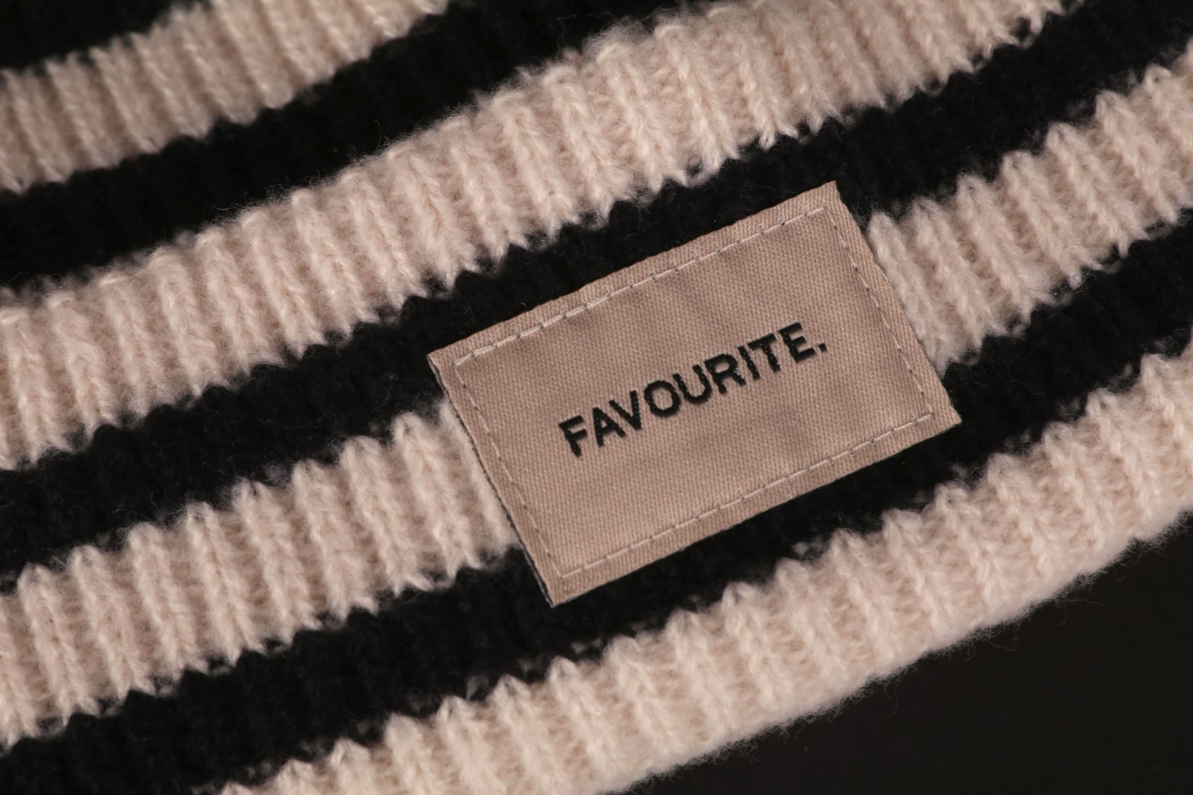 A striped knit with a label that reads "Favourite"
