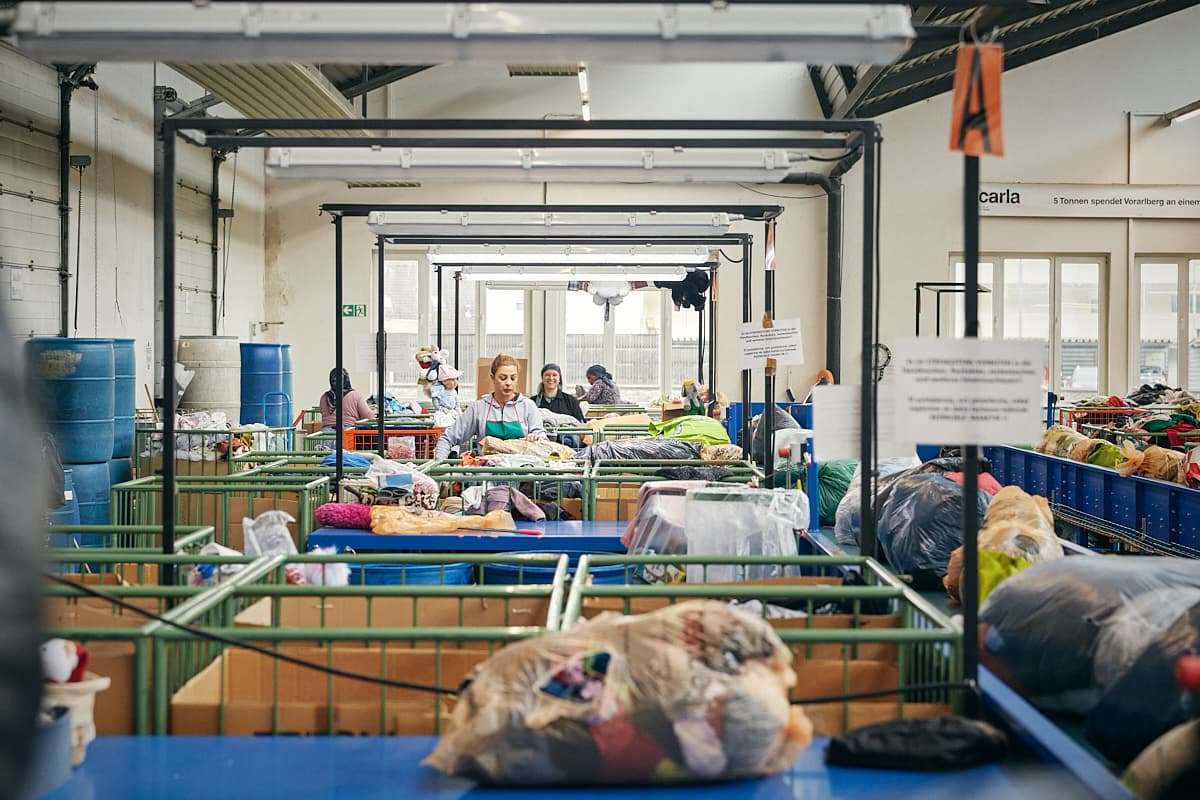 The sorting hall at Carla Vorarlberg, with workers at sorting tables