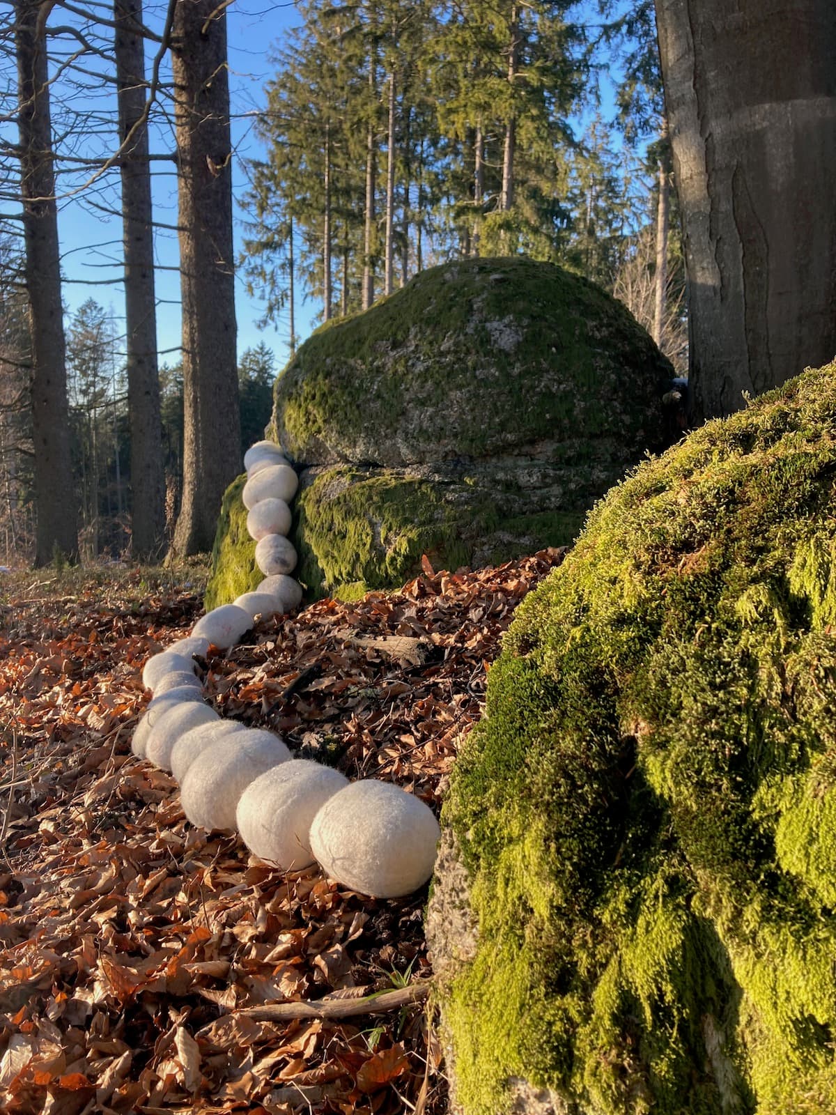 Steinreich installation: 300 stone-like objects made from discarded wool and family textiles