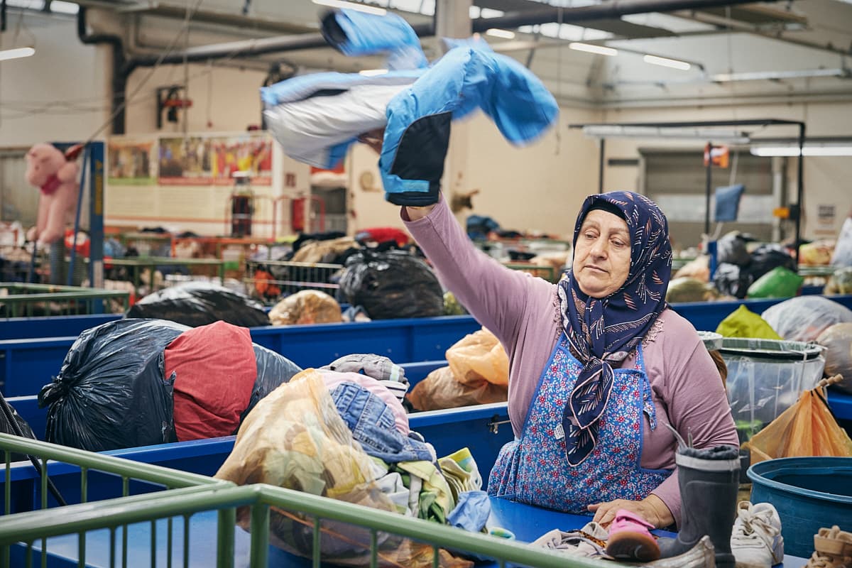 A worker hand-sorting a garment at Carla Vorarlberg
